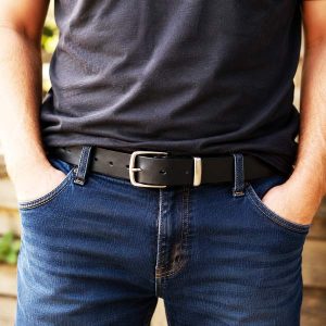 man with black full grain leather belt and silver brass buckle